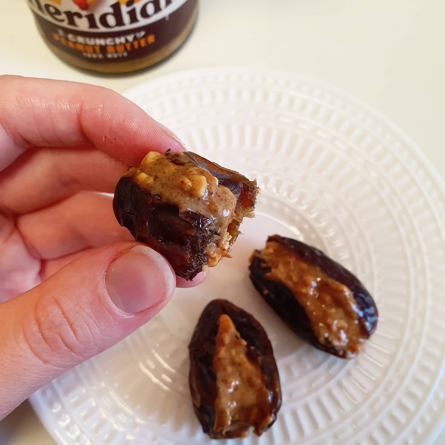 Few things in life are tastier than peanut butter stuffed dates. Use crunchy nut butter for gorgeous Snickers bar texture... @meridianfoods is unmatched! #veganfood